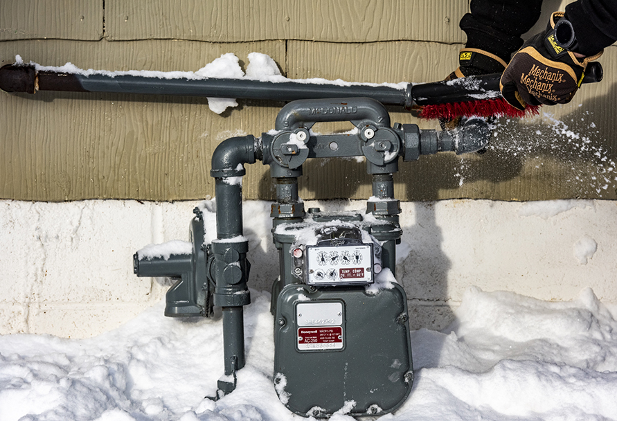 Clearing snow from a natural gas meter