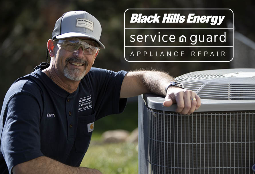 Technician leaning on air conditioner unit