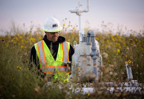 gas technician working at meter in field