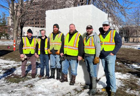 team standing next to ice